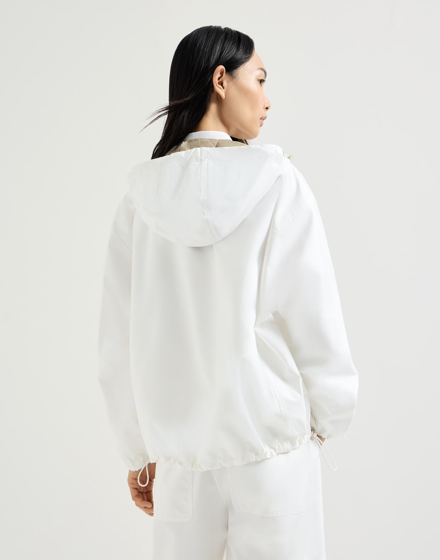 Nylon hooded outerwear jacket with logo and precious trims