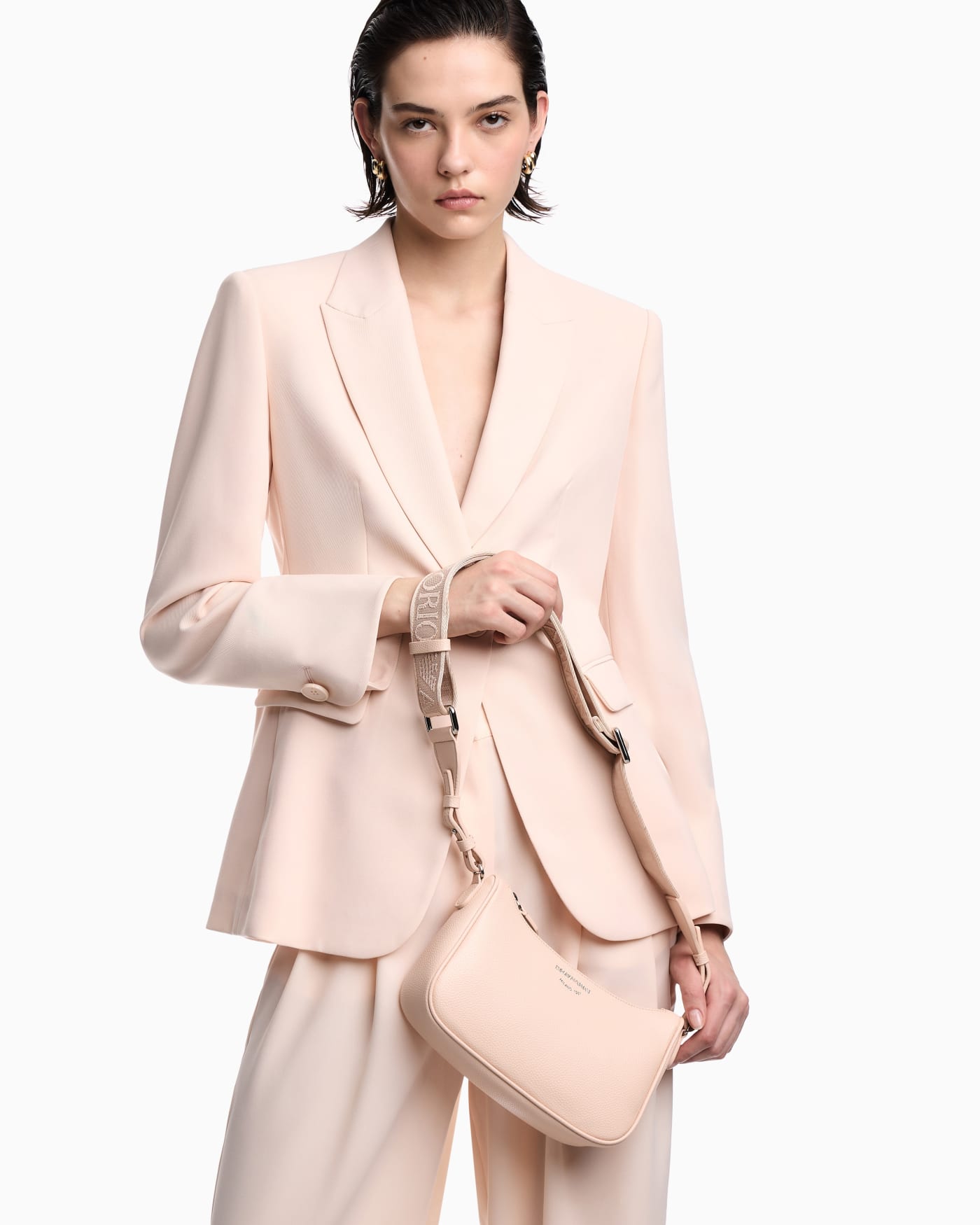 Pebbled shoulder bag with a zip closure and adjustable strap