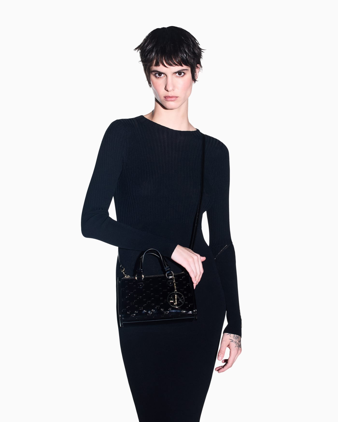 Glossy handbag with embossed pattern and detachable strap