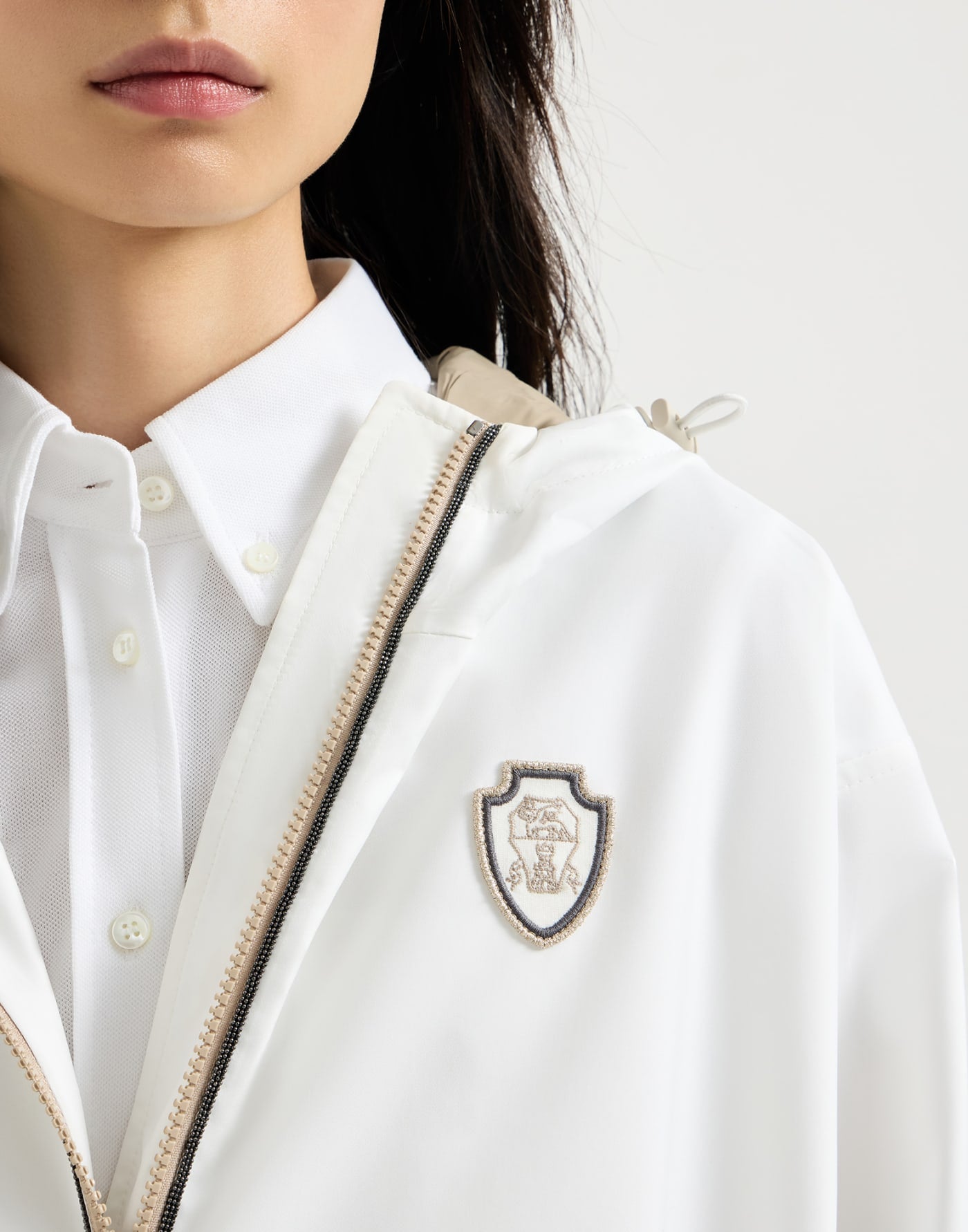 Nylon hooded outerwear jacket with logo and precious trims