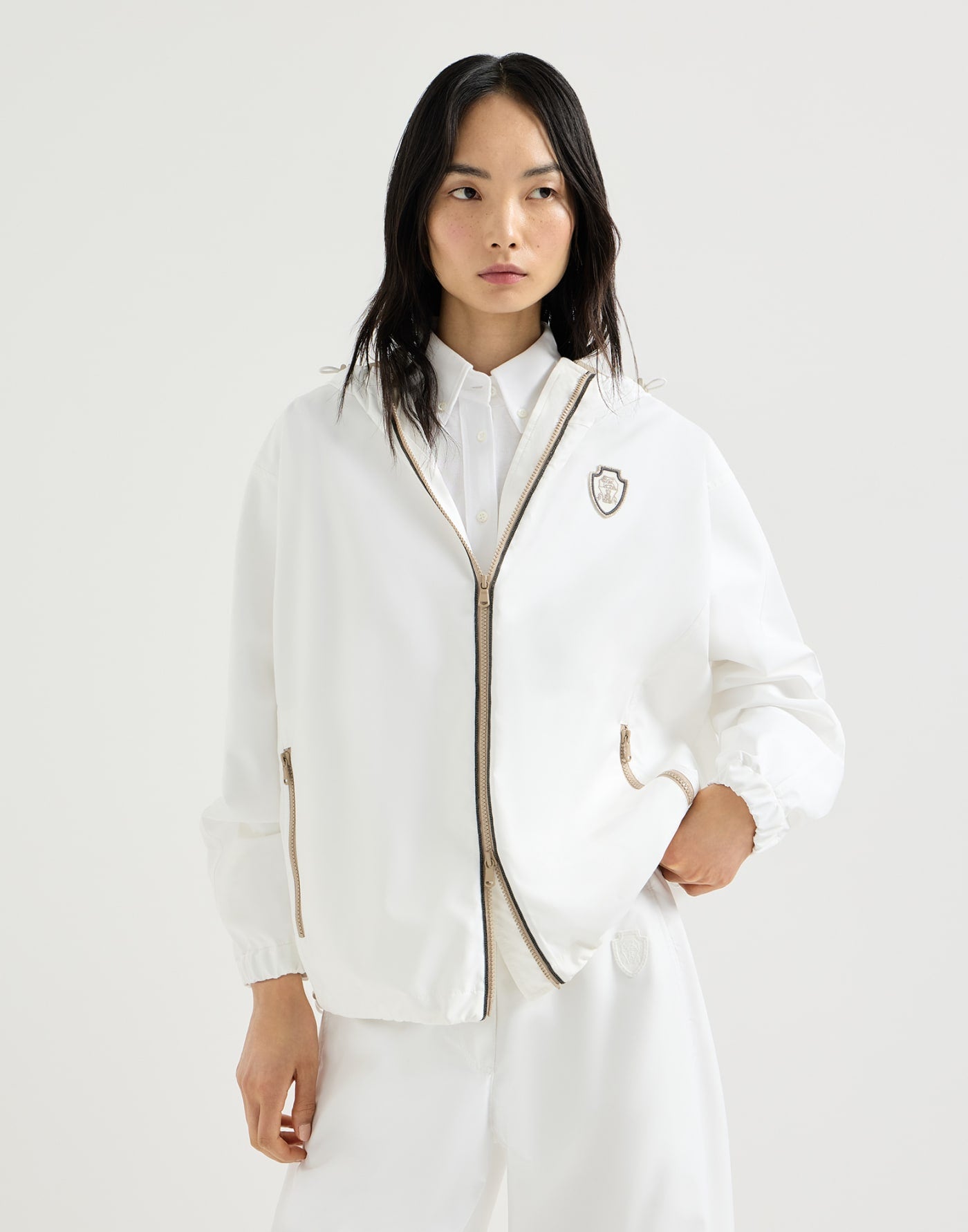 Nylon hooded outerwear jacket with logo and precious trims