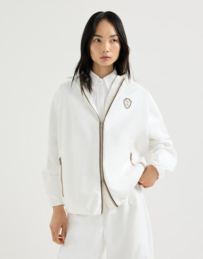Nylon hooded outerwear jacket with logo and precious trims