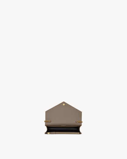 CASSANDRE envelope chain wallet in GRAIN DE POUDRE leather