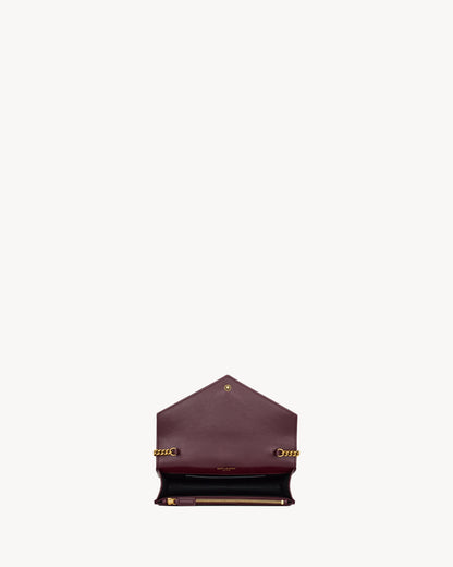CASSANDRE envelope chain wallet in GRAIN DE POUDRE leather