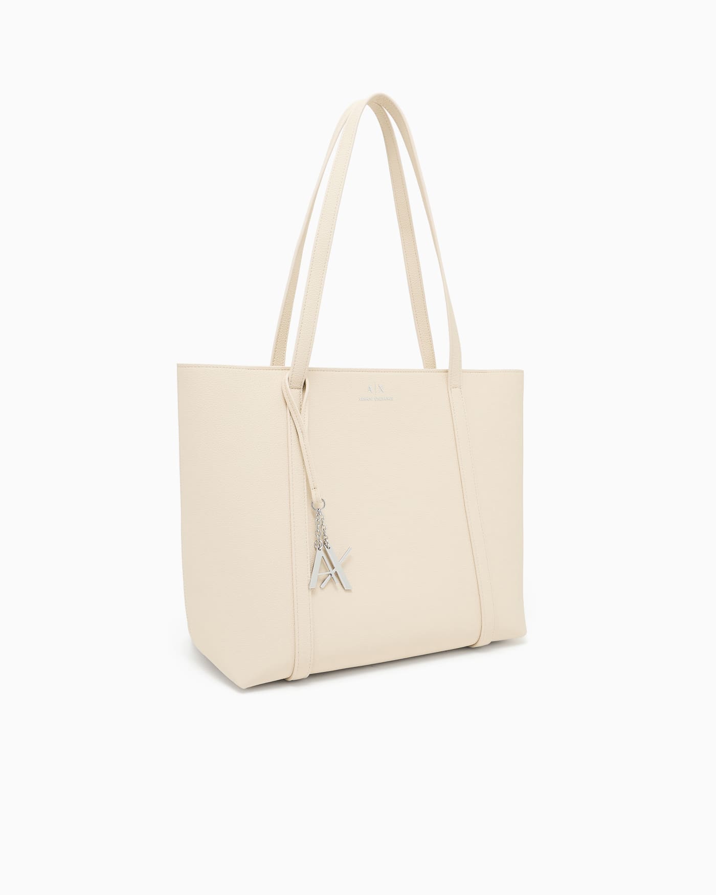 Textured tote bag with handles and a decorative charm