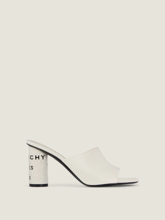 Tape heeled mules in leather