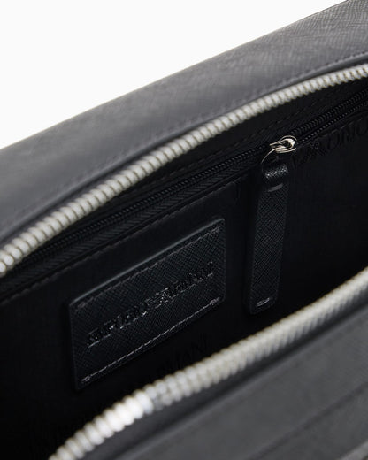 Textured crossbody bag with a front pocket and a metal logo
