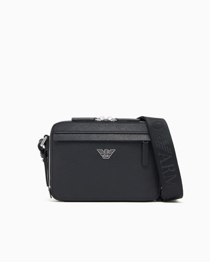 Textured crossbody bag with a front pocket and a metal logo
