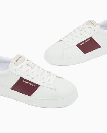 Leather sneakers with an embossed logo and contrasting panel