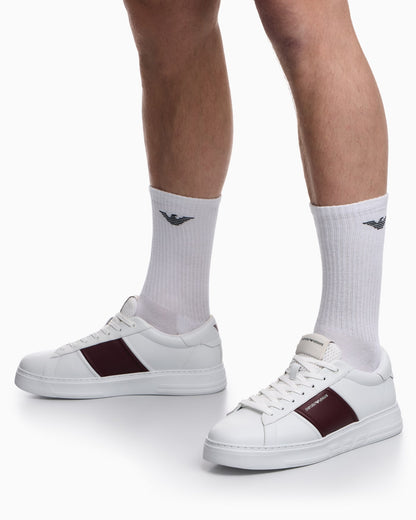 Leather sneakers with an embossed logo and contrasting panel