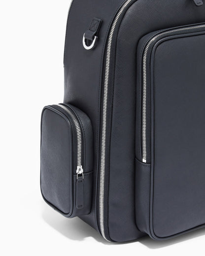 Backpack with a metallic logo and silver-tone zips