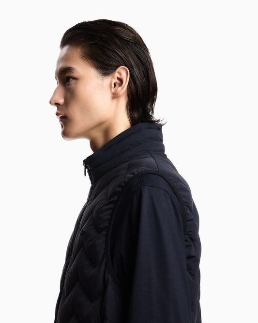 Nylon down jacket sleeveless with a chevron quilt Essential