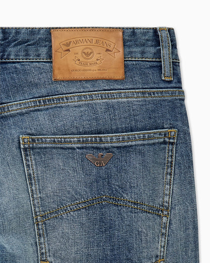 Straight-leg denim jeans with faded wash and whiskering