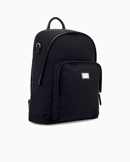 Backpack with a front zip pocket and a metal logo plaque