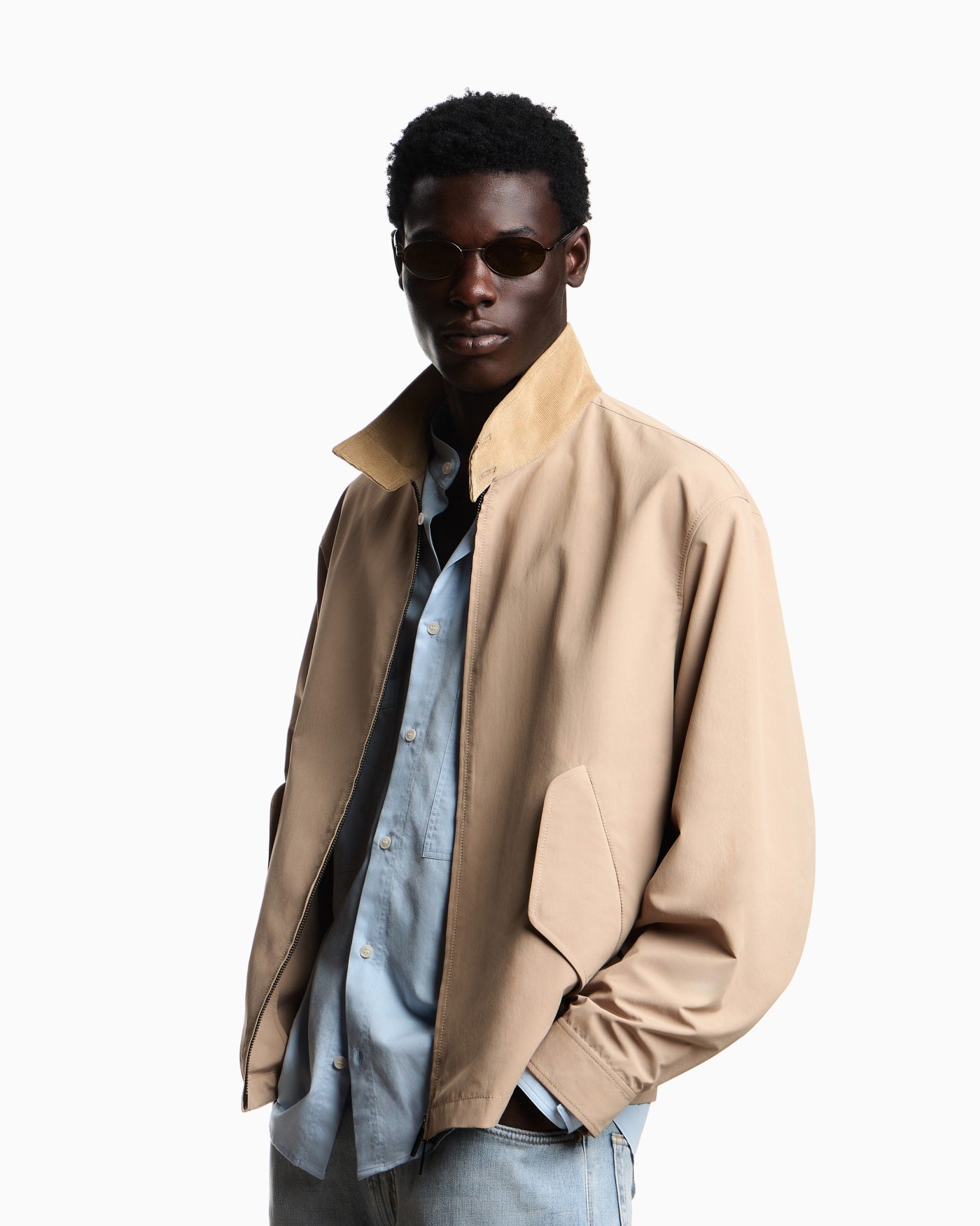 Blouson jacket with high collar and angled flap pockets