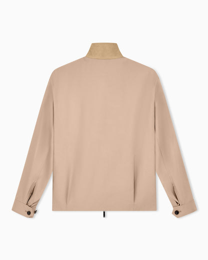 Blouson jacket with high collar and angled flap pockets