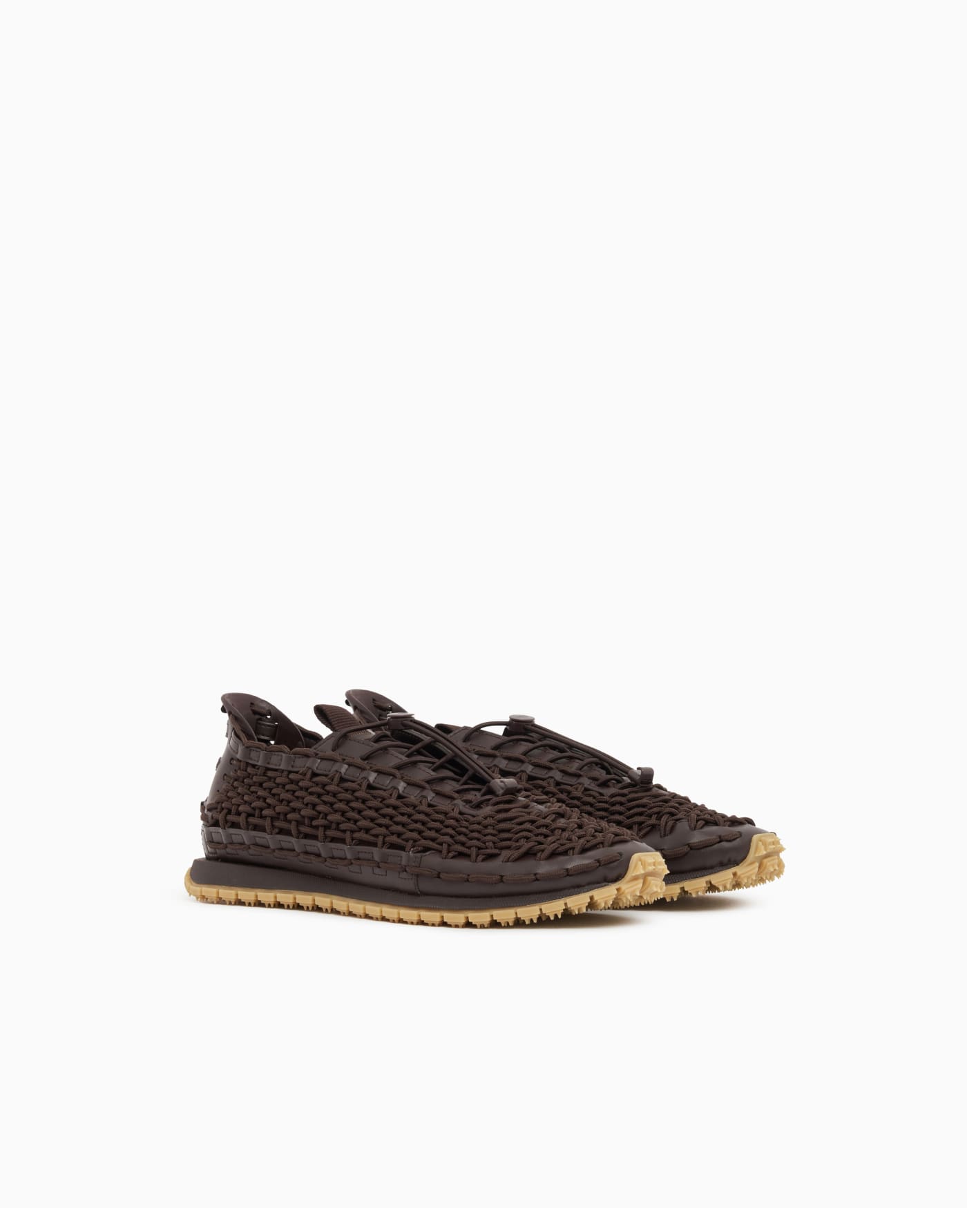 Sneakers with woven design and rugged rubber sole