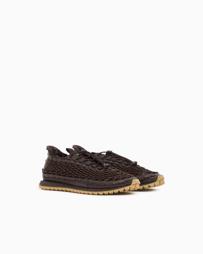 Sneakers with woven design and rugged rubber sole