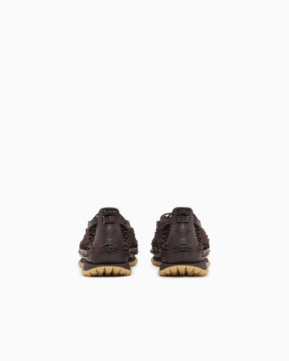 Sneakers with woven design and rugged rubber sole