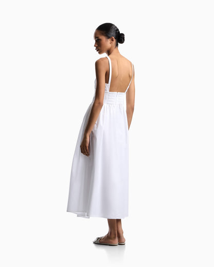 Long dress in poplin with smocked motif