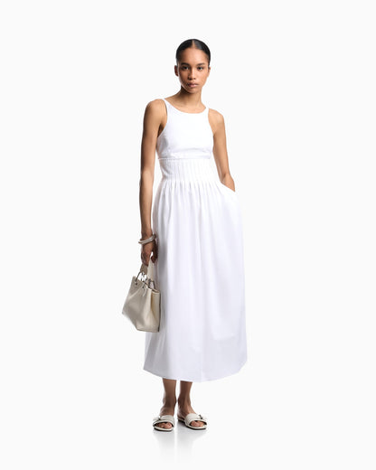 Long dress in poplin with smocked motif