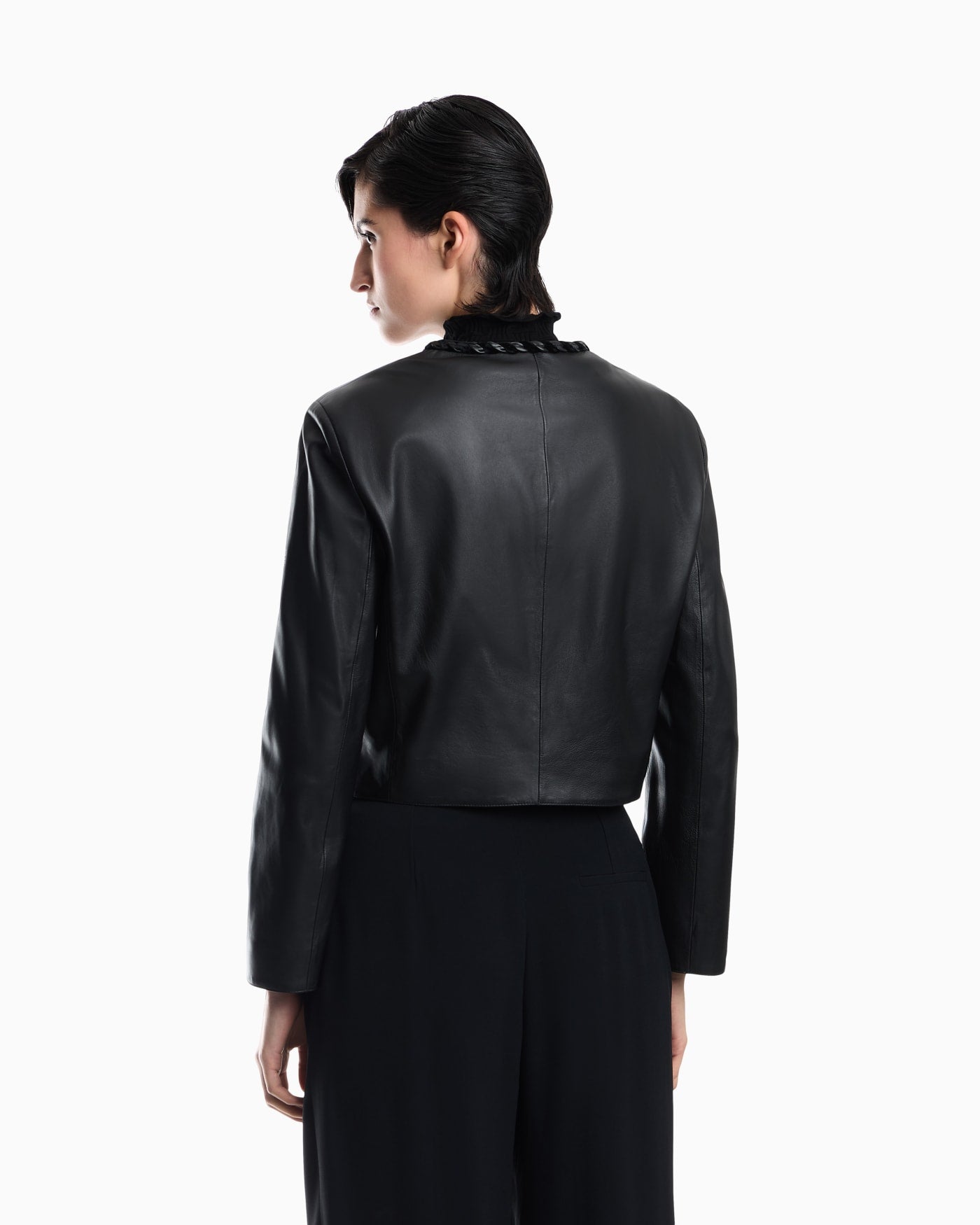 Cropped leather jacket with braided trim and button closure