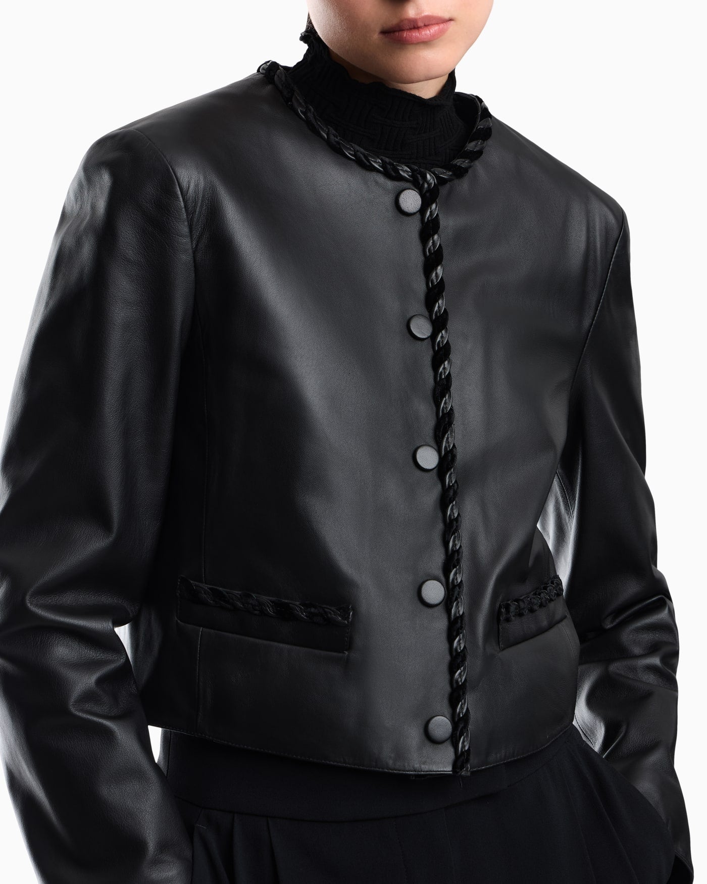 Cropped leather jacket with braided trim and button closure