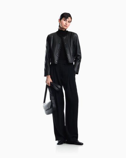Cropped leather jacket with braided trim and button closure