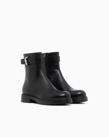 Leather ankle boots with side zip and buckled strap