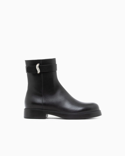 Leather ankle boots with side zip and buckled strap