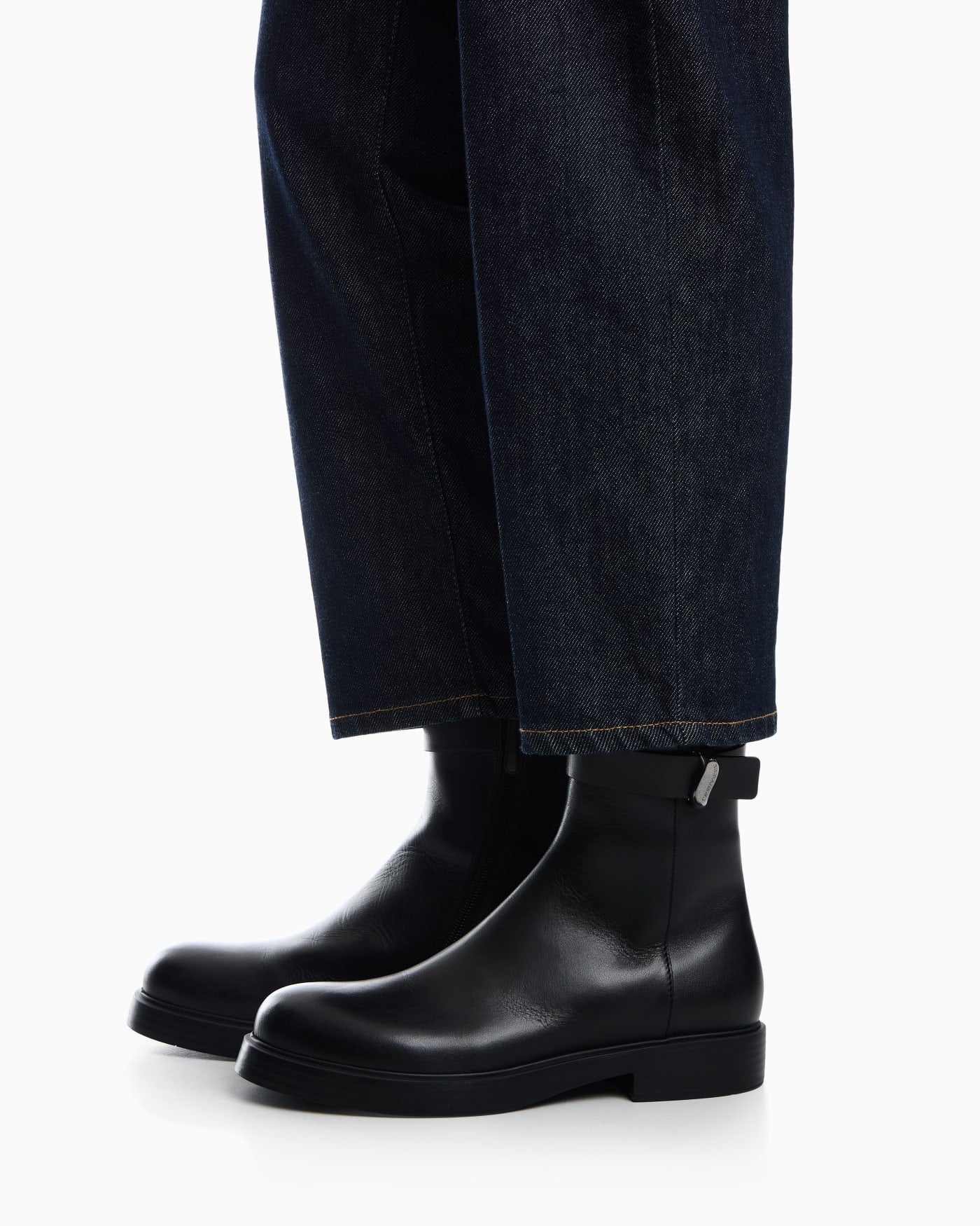 Leather ankle boots with side zip and buckled strap