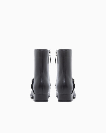 Nappa leather ankle boots with a side zip and metal buckle
