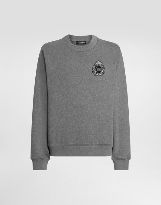 Sweatshirt with heraldic patch