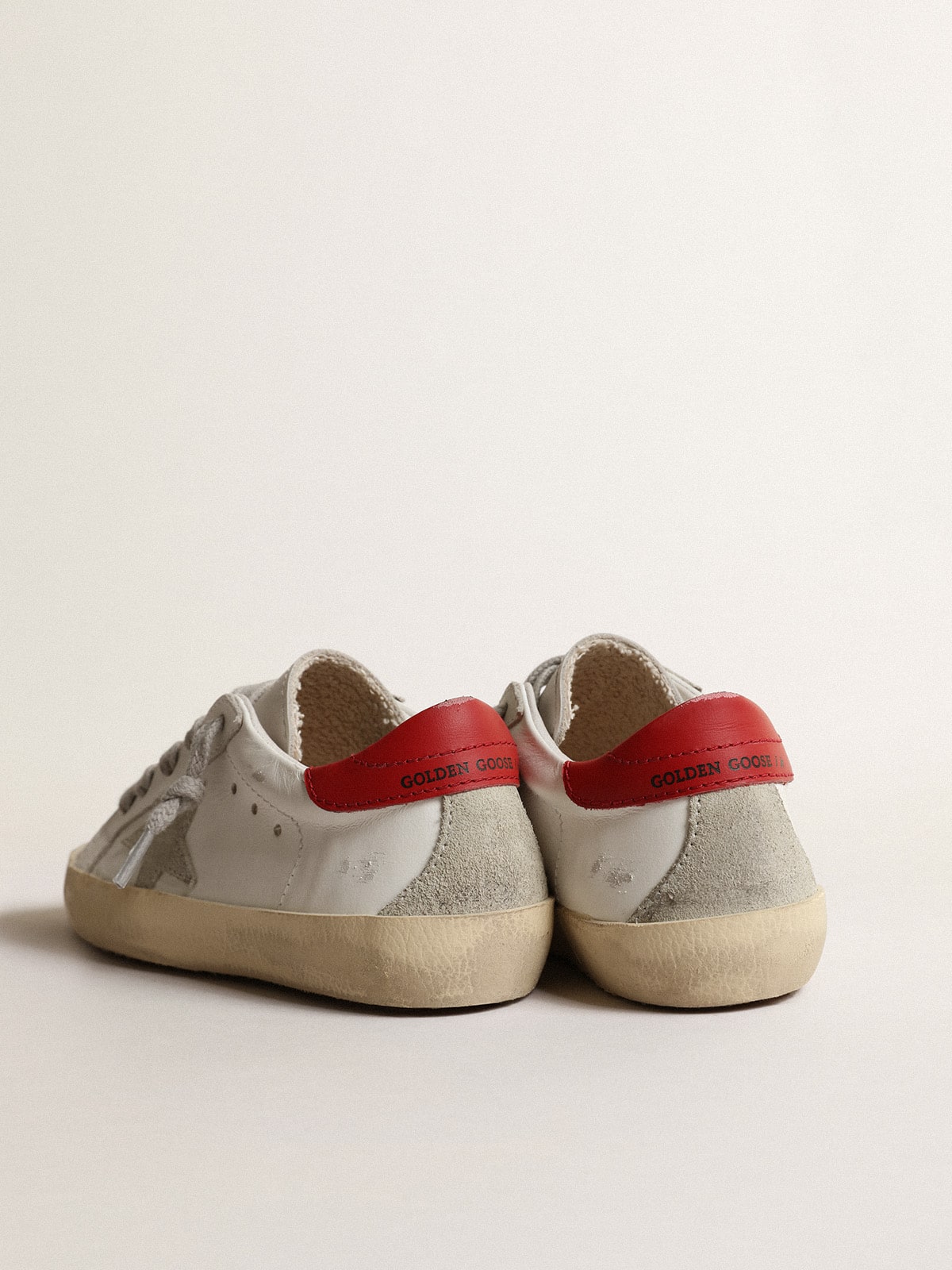 Super-Star Junior with suede star and red leather heel tab