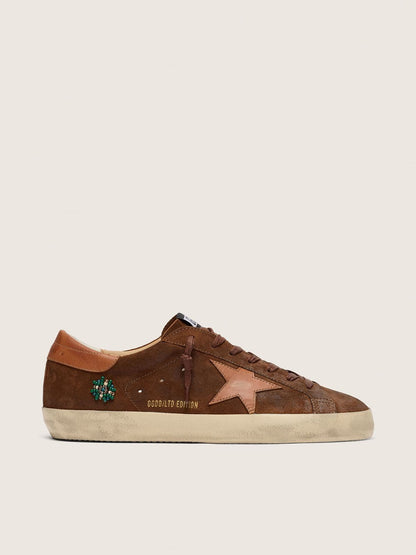Men’s Super-Star LTD in brown suede with brick-red leather star and embroidery with green beads