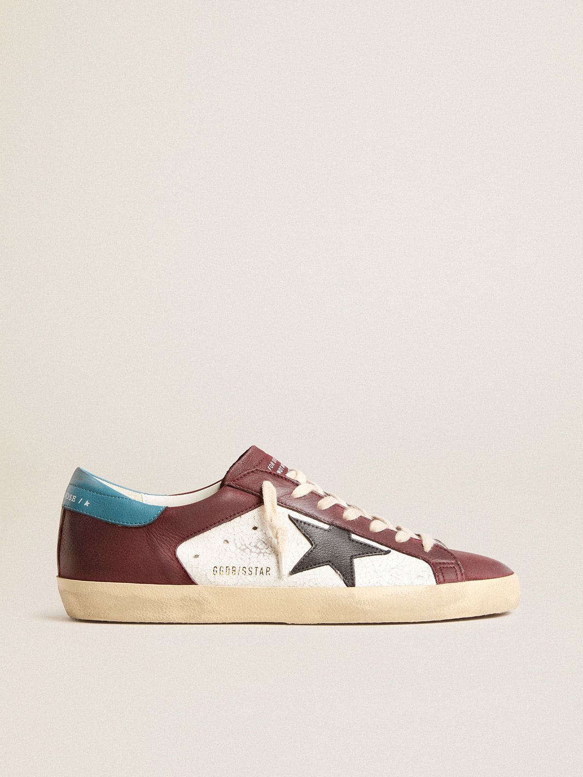 Men’s Super-Star in crackle leather with brown star and teal heel tab