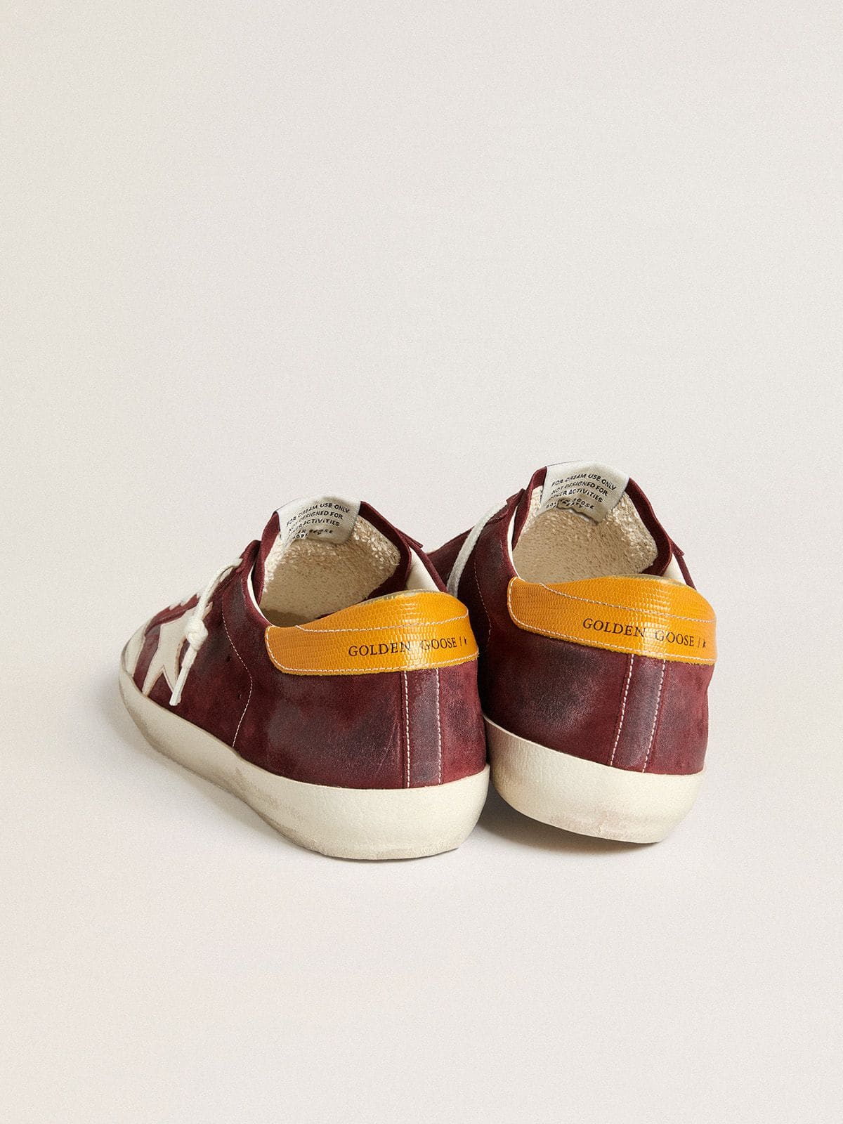 Men’s Super-Star in brick-red suede with white leather star and animal-print heel tab