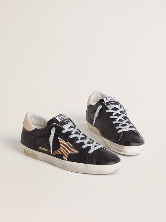 Women’s Super-Star in black nappa leather with zebra-print pony skin star and beige leather heel tab