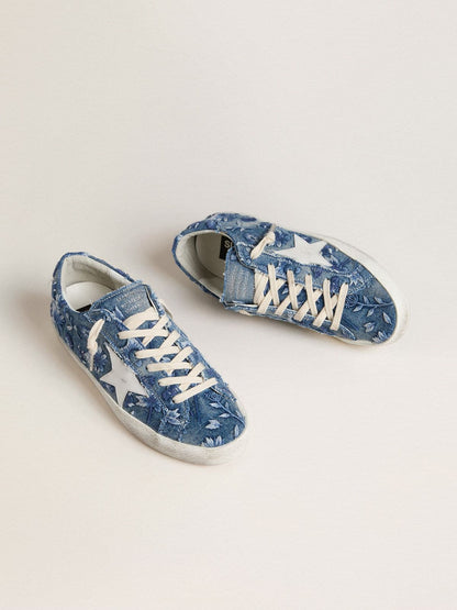 Women's Super-Star LTD in light blue denim with a white leather star and embroidered flowers
