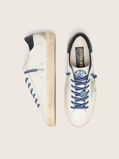 Women’s Super-Star LTD in white leather with suede star and blue leather heel tab
