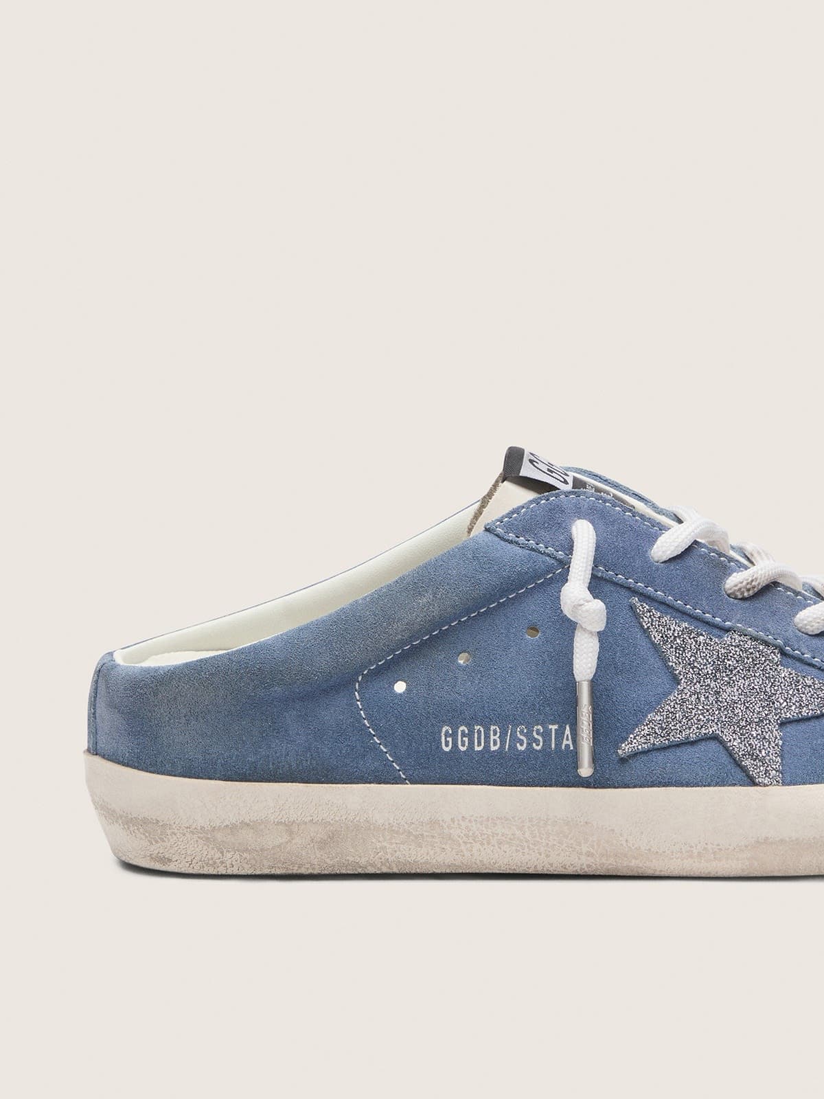 Women’s Super-Star Sabots in denim-blue suede with silver glitter star