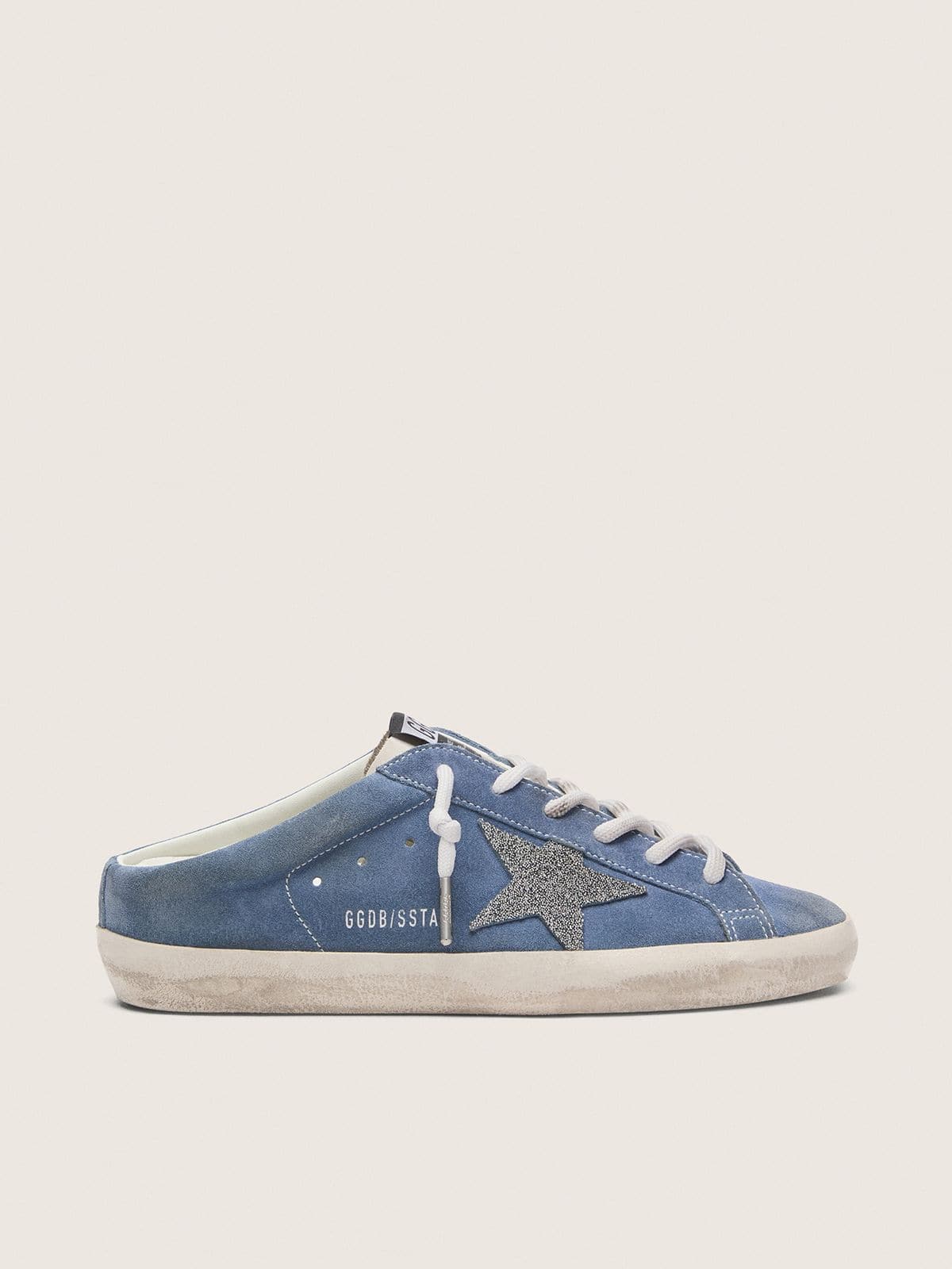 Women’s Super-Star Sabots in denim-blue suede with silver glitter star