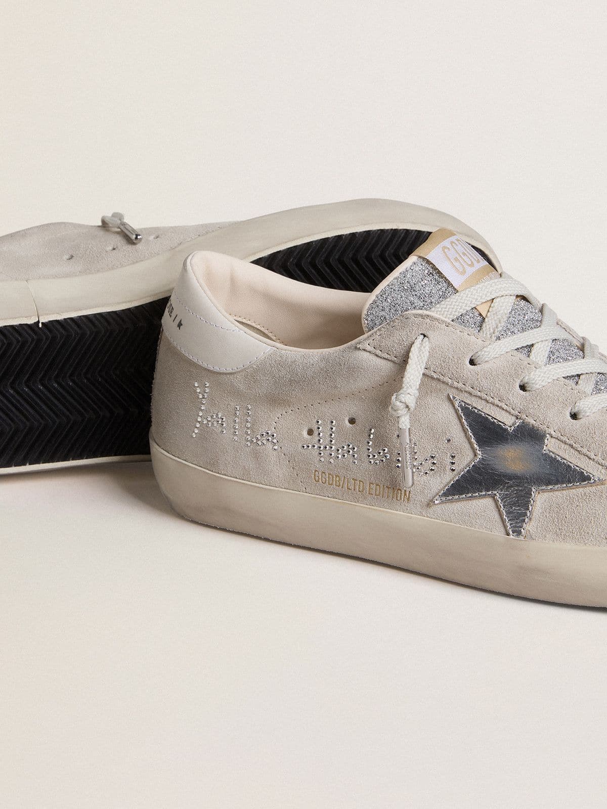Women’s Super-Star LTD in gray suede with laminated leather star and Swarovski crystal tongue