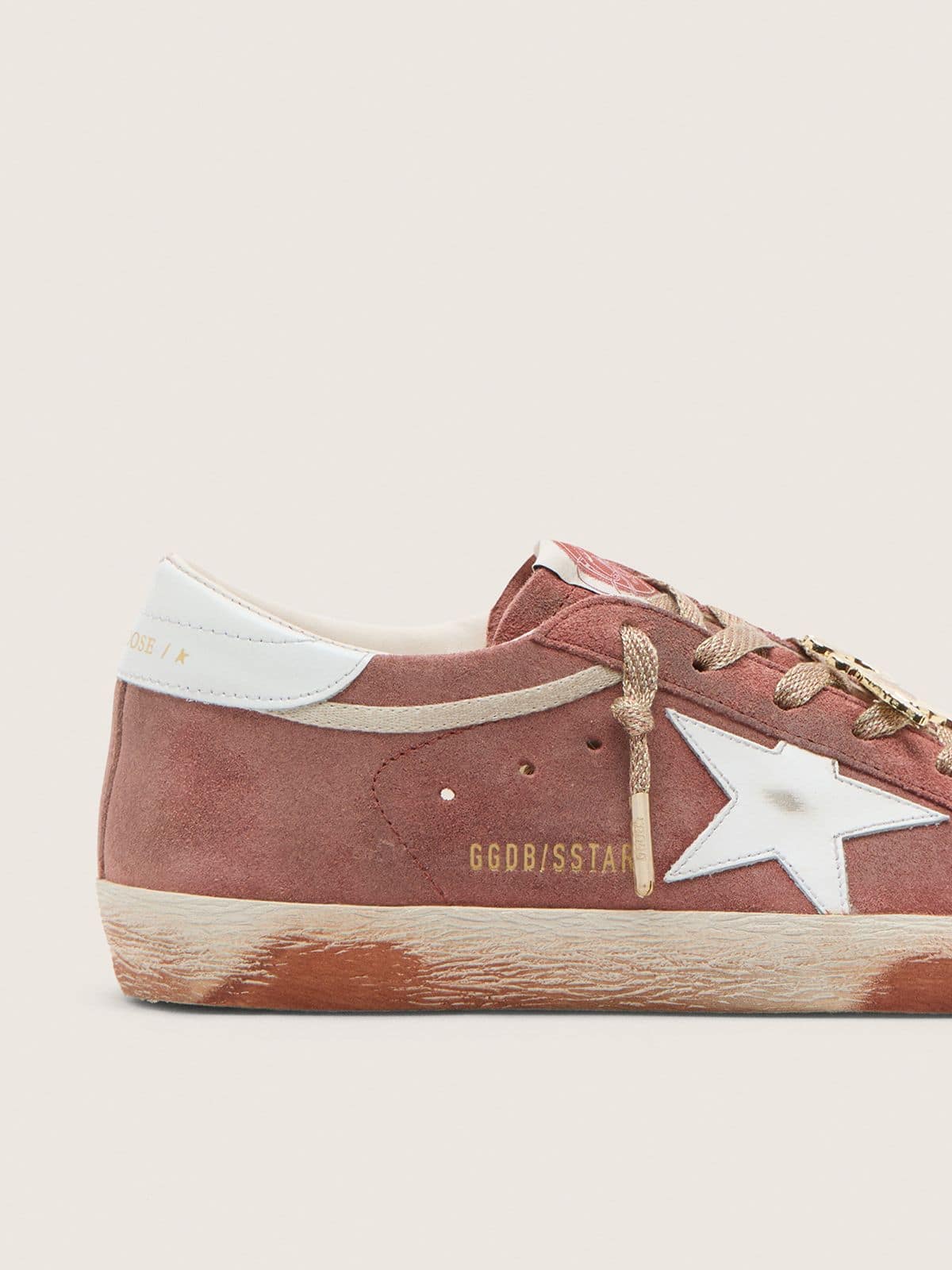 Women’s Super-Star in rust suede with metallic platinum leather star