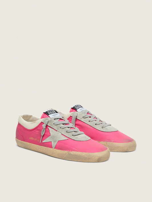 Women’s Super-Star in neon pink nylon with light gray suede star