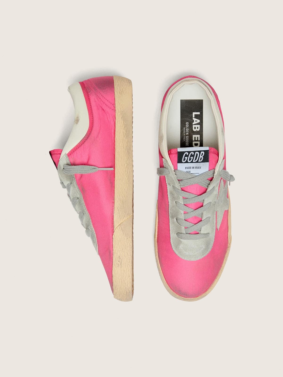 Women’s Super-Star in neon pink nylon with light gray suede star