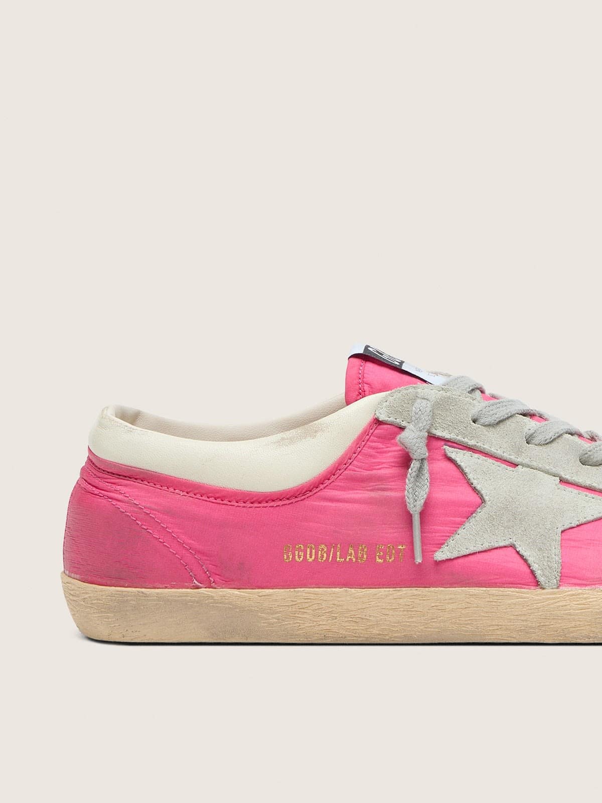 Women’s Super-Star in neon pink nylon with light gray suede star