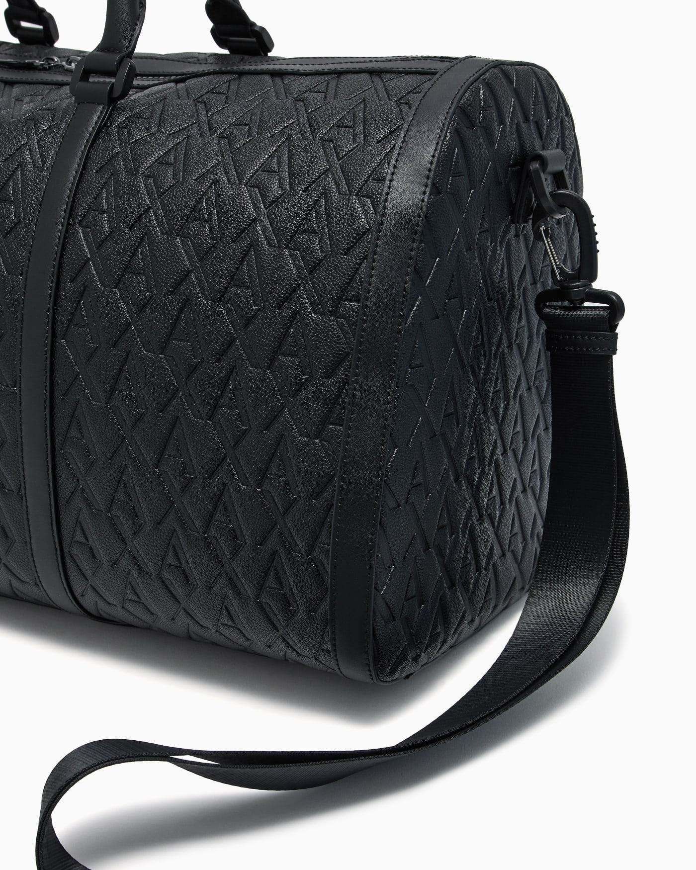 Duffel bag with an embossed pattern and a shoulder strap