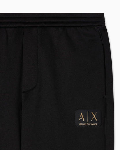 Jogger pants with metal logo