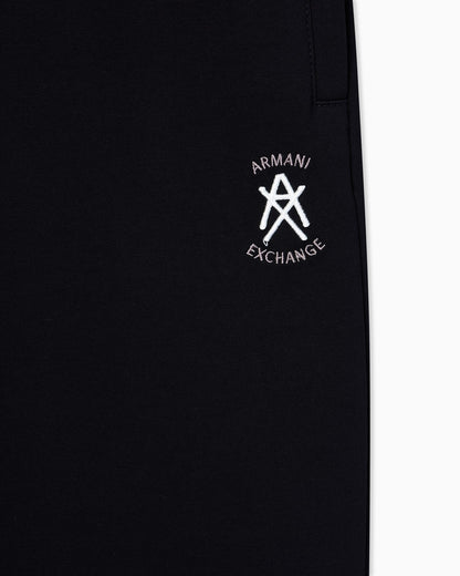 Jogger pants with metal logo